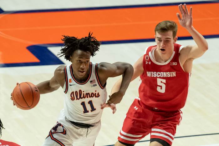 Illinois Fighting Illini guard Ayo Dosunmu (11) drives against Wisconsin Badgers forward Tyler Wahl (5) during the first half at State Farm Center. Dosunmu ended with a triple-double (21 points, 12 assists and 12 rebounds) in a 75-60 win over Wisconsin.