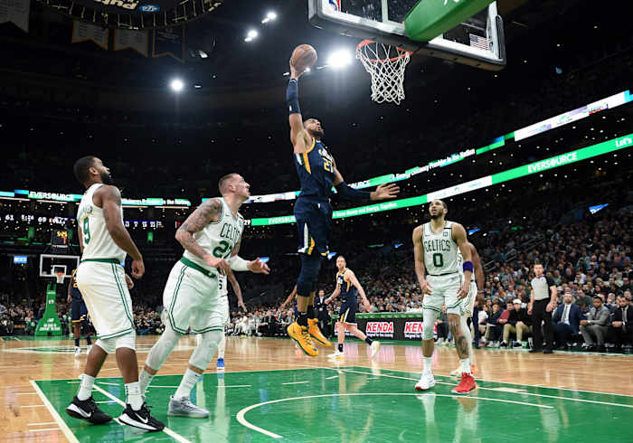 Rudy Gobert (27) dunks over Jayson Tatum (0) in a game against the Boston Celtics