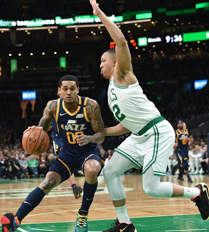 Jordan Clarkson (00) backs down a defender on his way to the hoop
