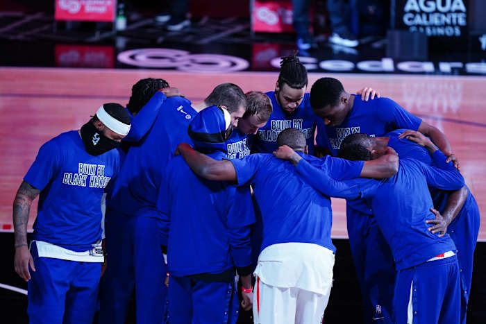Feb 15, 2021; Los Angeles, California, USA; LA Clippers players huddle wearing Black History month shirts before the game against the Miami Heat at Staples Center. Mandatory Credit: Kirby Lee-USA TODAY Sports