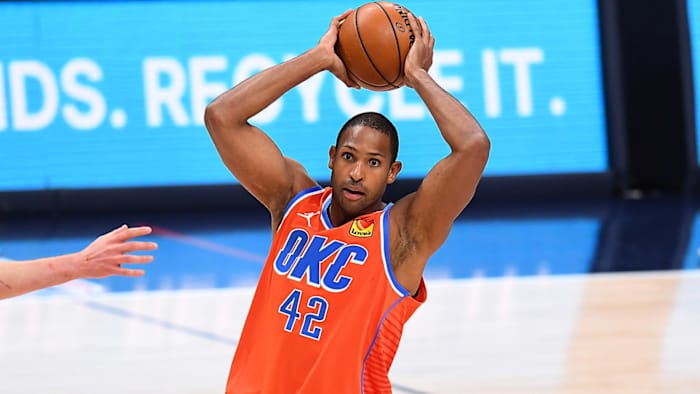 Al Horford holding a basketball over his head