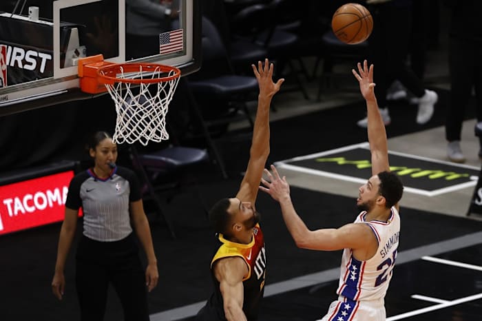 Rudy Gobert (27) attempts to block Ben Simmons (25) 