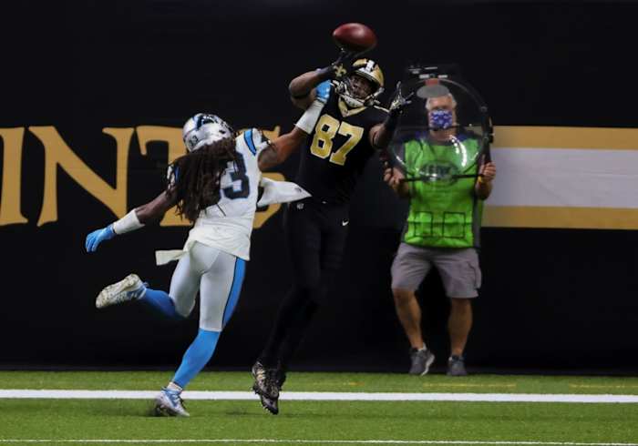 Oct 25, 2020; New Orleans, Louisiana, USA; Saints tight end Jared Cook (87) catches a touchdown over Carolina safety Tre Boston (33). Mandatory Credit: Derick E. Hingle-USA TODAY