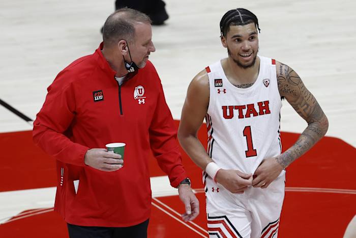 Mar 6, 2021; Salt Lake City, Utah, USA; Utah Utes head coach Larry Krystkowiak and forward Timmy Allen (1) react on the way to the locker room at halftime against the Arizona State Sun Devils at Jon M. Huntsman Center.