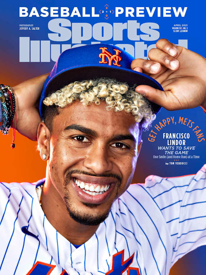 Francisco Lindor poses with his new Mets hat
