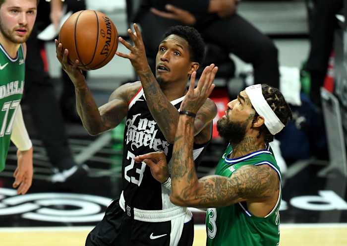 Dec 27, 2020; Los Angeles, California, USA; Los Angeles Clippers guard Lou Williams (23) drives to the basket against Dallas Mavericks center Willie Cauley-Stein (right) in the first quarter at Staples Center. Mandatory Credit: Jayne Kamin-Oncea-USA TODAY Sports