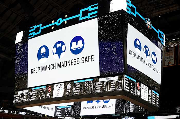 A sign urges fans to "Keep March Madness Safe"