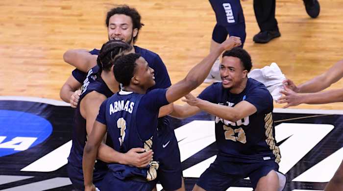 Oral Roberts Golden Eagles celebrate their 81-78 victory over the Florida Gators during the second round of the 2021 NCAA Tournament on Sunday, March 21, 2021,