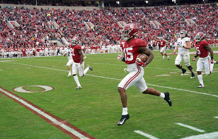 Nov 23, 2019; Tuscaloosa, AL, USA; Alabama Crimson Tide defensive back Xavier McKinney (15) returns an interception for a touchdown during the first quarter against the Western Carolina Catamounts at Bryant-Denny Stadium.