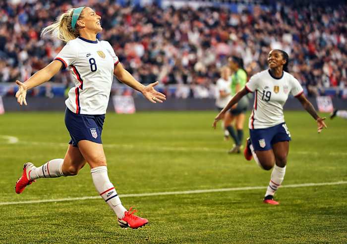 Julie Ertz and Crystal Dunn celebrate vs. Spain.