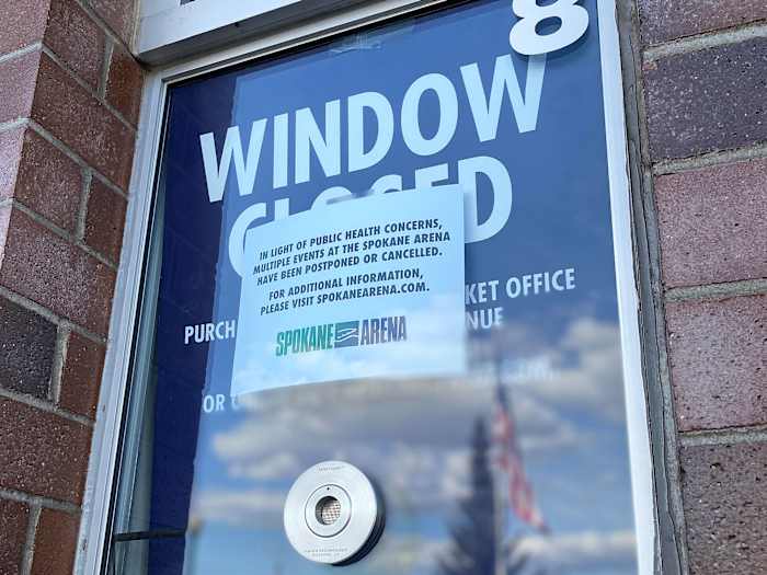 A ticket window outside Spokane Arena carries news of event cancellations due to COVID-19.