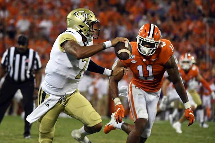 Aug 29, 2019; Clemson, SC, USA; Georgia Tech Yellow Jackets quarterback Lucas Johnson (7) carries the ball against Clemson Tigers linebacker Isaiah Simmons (11) during the second quarter at Clemson Memorial Stadium.