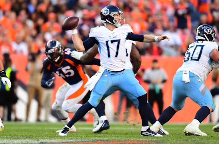 Tennessee Titans quarterback Ryan Tannehill (17) passes the ball in the fourth quarter against the against the Denver Broncos at Empower Field at Mile High.