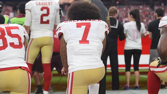Colin Kaepernick taking a knee
