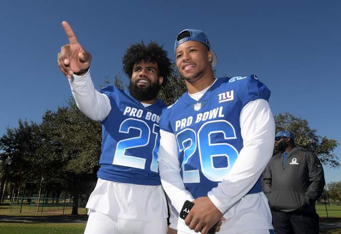 Jan 25, 2019; Kissimmee, FL, USA; Dallas Cowboys running back Ezekiel Elliott (26) and New York Giants running back Saquon Barkley (26) pose during NFC practice at ESPN Wide World of Sports Complex.