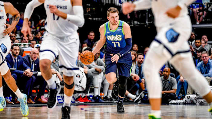 Luka Doncic brings the ball up the court against the Grizzlies