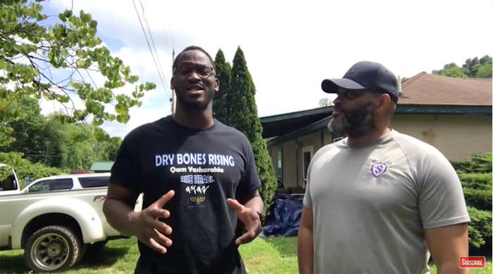 Former Packers player Kabeer Gbaja-Biamila makes a video with Straitway Ministry leader Charles Dowell
