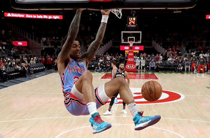 Atlanta Hawks forward John Collins (20) dunks in the first quarter against the Brooklyn Nets at State Farm Arena.