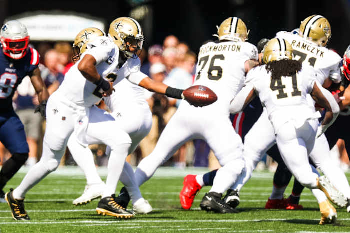 New Orleans Saints quarterback Jameis Winston (2) hands off to running back Alvin Kamara (41) against New England Patriots. Mandatory Credit: Stephen Lew-USA TODAY Sports