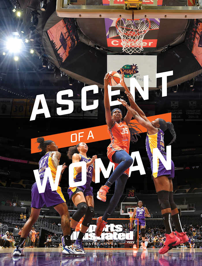 Jonquel Jones driving to the basket with the words Ascent of a Woman