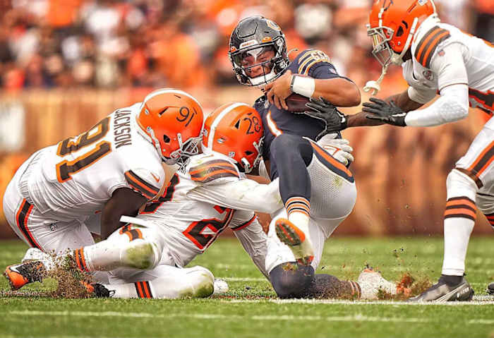 Justin Fields slides down during a game against the Browns