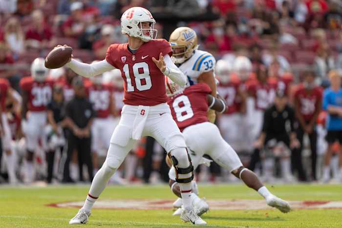 McKee throws a pass against UCLA. 