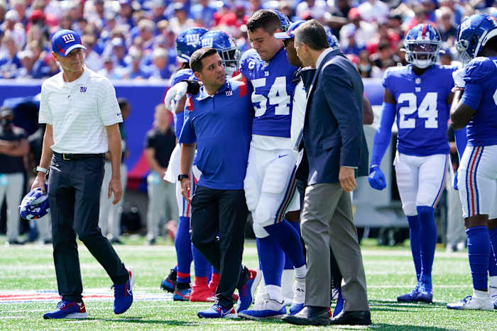 New York Giants inside linebacker Blake Martinez (54) is helped off the field in the first half at MetLife Stadium on Sunday, Sept. 26, 2021, in East Rutherford.