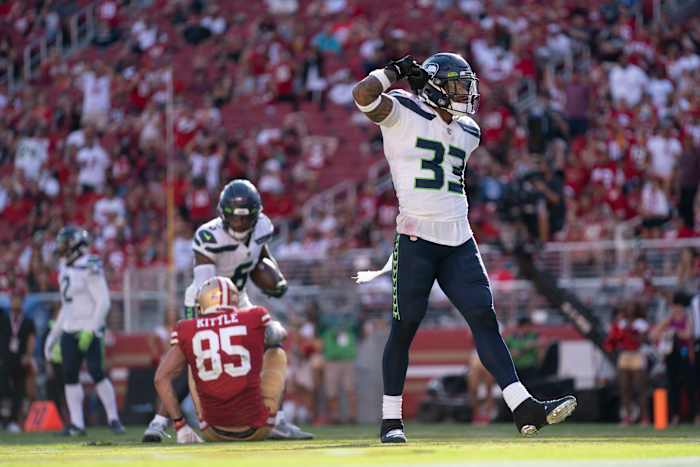 Seattle Seahawks strong safety Jamal Adams (33) celebrates after hitting San Francisco 49ers tight end George Kittle (85) for an incomplete pass during the third quarter at Levi's Stadium.