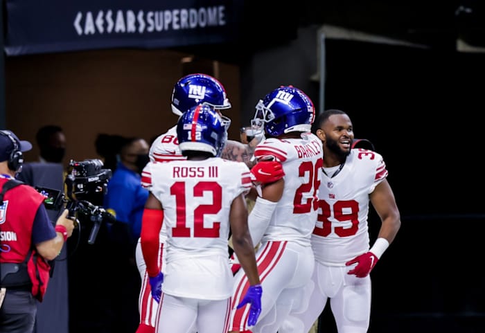 Oct 3, 2021; New Orleans, Louisiana, USA; New York Giants running back Saquon Barkley (26) reacts to scoring the winning touchdown against the New Orleans Saints in overtime at Caesars Superdome.