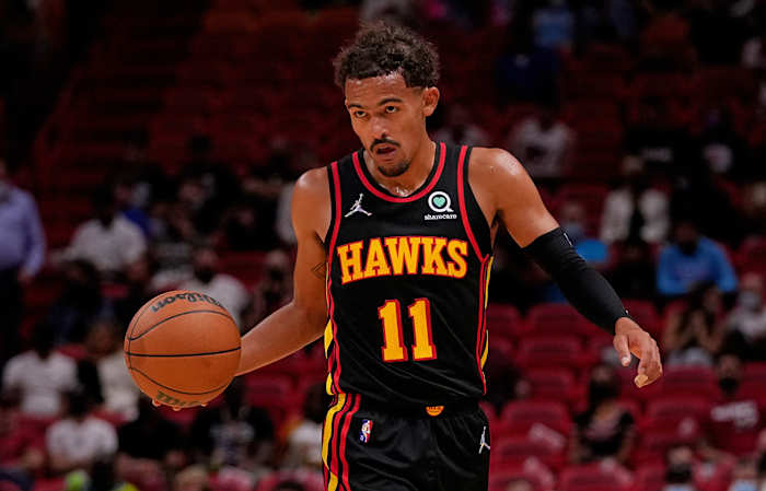 Atlanta Hawks guard Trae Young (11) dribbles the ball up the court against the Miami Heat during the first half at FTX Arena.
