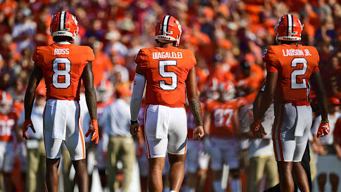 Clemson offensive players look on during a game