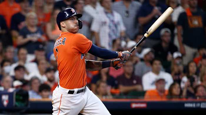 Oct 8, 2021; Houston, Texas, USA; Houston Astros shortstop Carlos Correa (1) hits a double and drives in a run against the Chicago White Sox during the seventh inning in Game 2 of the 2021 ALDS at Minute Maid Park.