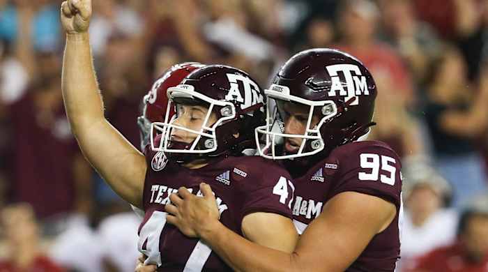 Texas A&M Aggies punter Nik Constantinou (95) celebrates Texas A&M Aggies place kicker Seth Small (47) 28 yard game game winning field goal against the Alabama Crimson Tide in the fourth quarter