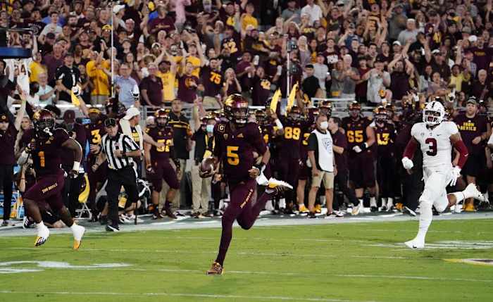 Arizona State quarterback Jayden Daniels (5) runs for a touchdown against Stanford.