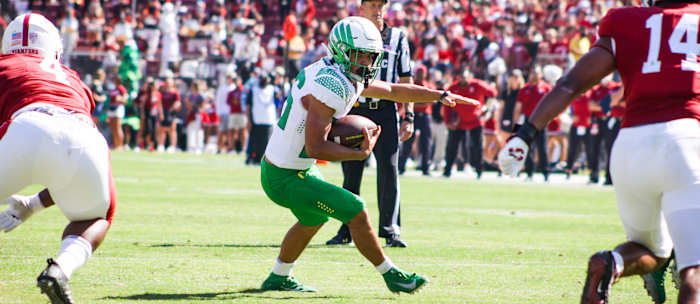 Travis Dye cuts upfield against Stanford.