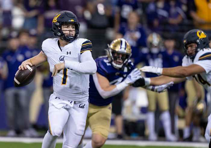 California Golden Bears quarterback Chase Garbers (7) scrambles out of the pocket during the second half against the Washington Huskies at Alaska Airlines Field at Husky Stadium.