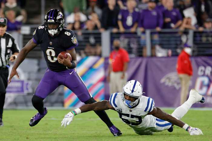 Oct 11, 2021; Baltimore, Maryland, USA; Baltimore Ravens quarterback Lamar Jackson (8) runs with the ball past Indianapolis Colts outside linebacker Darius Leonard (53) chases during the third quarter at M&T Bank Stadium. Mandatory Credit: Geoff Burke-USA TODAY Sports