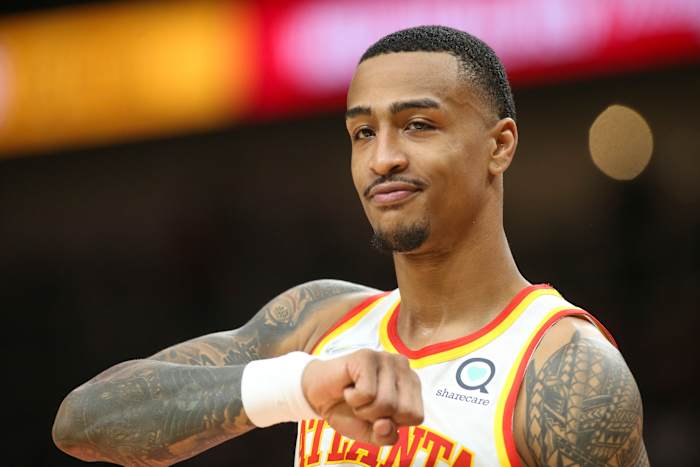 Atlanta Hawks forward John Collins (20) shows emotion on the court against the Miami Heat in the first half at State Farm Arena.