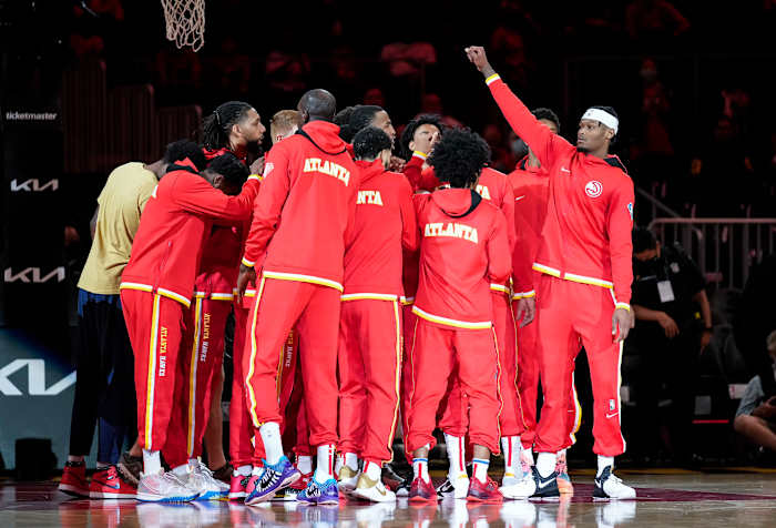 Atlanta Hawks players huddle before playing the Cleveland Cavaliers at State Farm Arena.