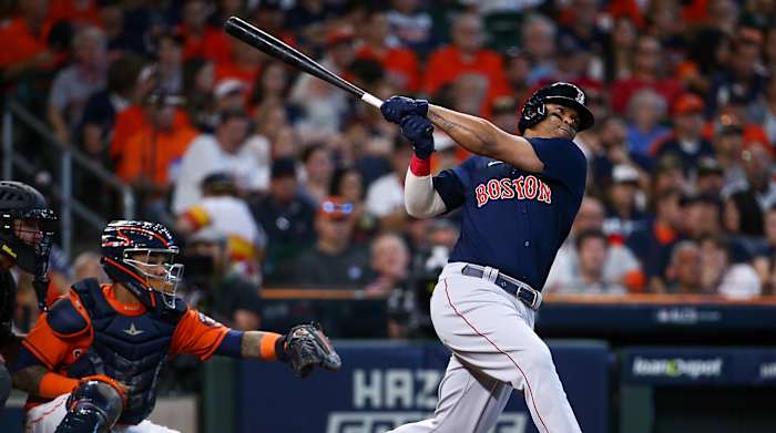 Oct 16, 2021; Houston, Texas, USA; Boston Red Sox third baseman Rafael Devers (11) hits a grand slam against the Houston Astros during the second inning in game two of the 2021 ALCS at Minute Maid Park.