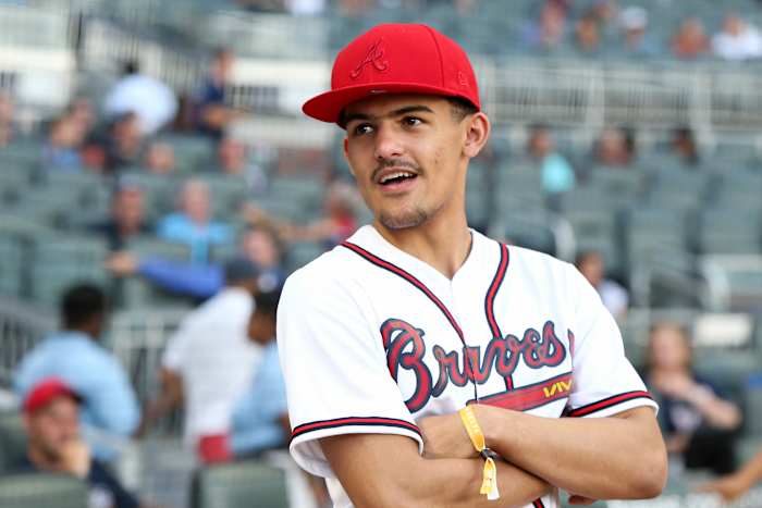 Atlanta Hawks guard Trae Young (11) on the field before a game between the Atlanta Braves and Cincinnati Reds at SunTrust Park.