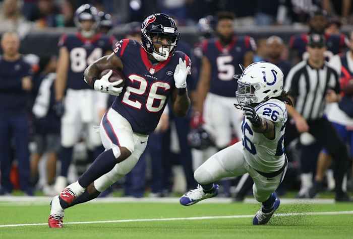 Houston Texans running back Lamar Miller (26) runs past Colts strong safety Clayton Geathers (26). Mandatory Credit: Troy Taormina-USA TODAY