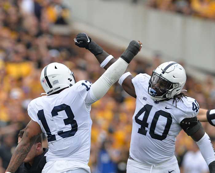 Penn State's Ellis Brooks (13) and Jesse Luketa celebrate against Iowa.
