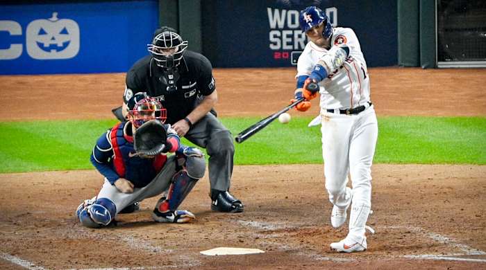 Oct 26, 2021; Houston, Texas, USA; Houston Astros first baseman Yuli Gurriel (10) hit a single against the Atlanta Braves during the fourth inning during game one of the 2021 World Series at Minute Maid Park.