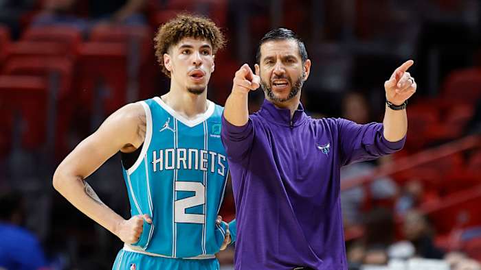 Charlotte Hornets guard LaMelo Ball and head coach James Borrego talk during a time out.