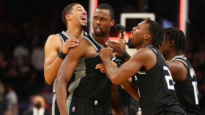 Sacramento Kings forward Harrison Barnes celebrates with teammates after hitting the game winning three pointer at the buzzer against the Phoenix Suns.