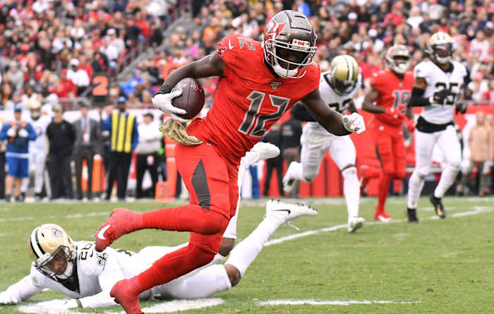 Tampa Bay Buccaneers receiver Chris Godwin (12) scores a touchdown against the New Orleans Saints. Mandatory Credit: Jonathan Dyer-USA TODAY