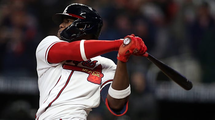 Atlanta Braves designated hitter Jorge Soler (12) hits a solo home run against the Houston Astros during the seventh inning of game four of the 2021 World Series at Truist Park.