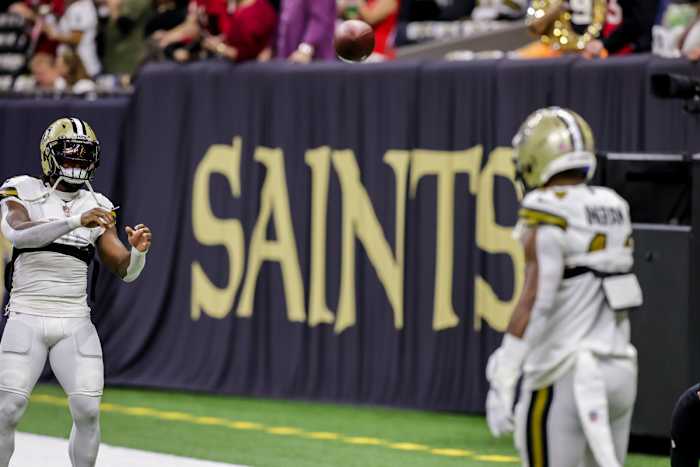 Oct 31, 2021; New Orleans, Louisiana, USA; New Orleans Saints running back Alvin Kamara (41) and running back Mark Ingram II (14) toss the football during pre-game warmups before the game against Tampa Bay Buccaneers at Caesars Superdome. Mandatory Credit: Stephen Lew-USA TODAY