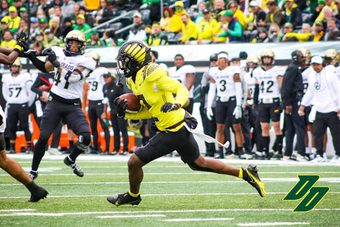Wright runs with the ball on a kick return against Colorado.